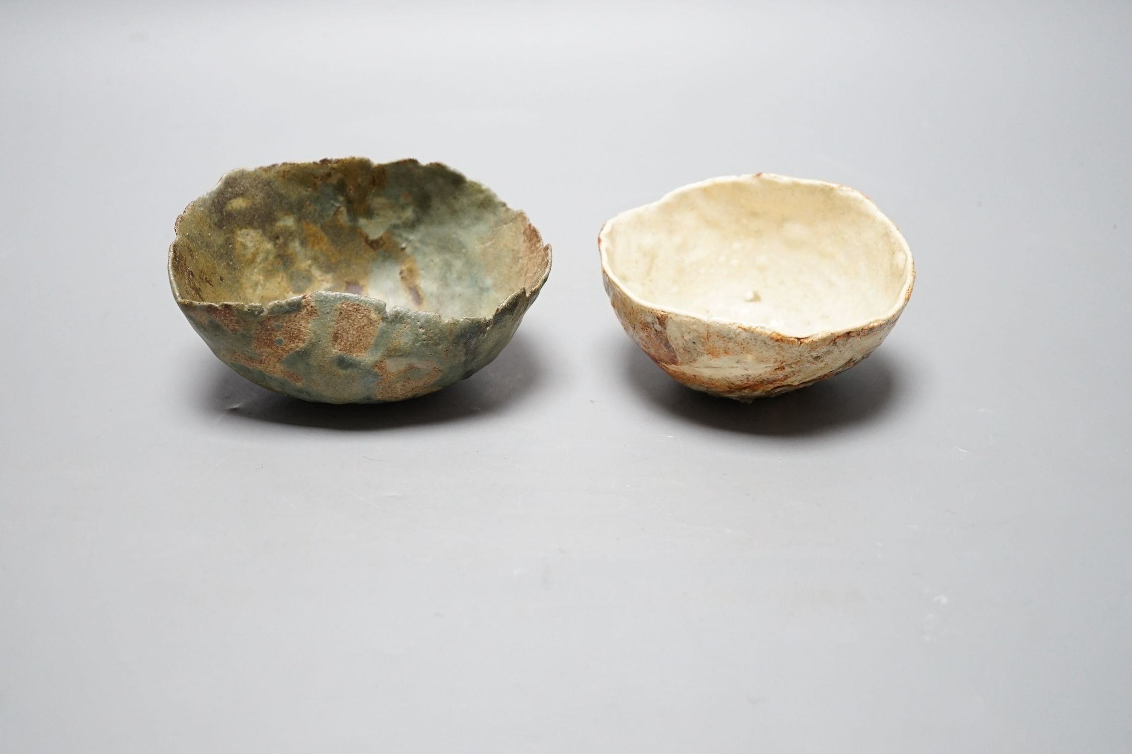 Ewen Henderson (1934-2000), two hand-built mixed laminated clay dishes, largest 12.5cm wide